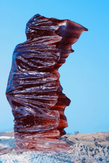 Amber resin sculpture, desert with blue sky
