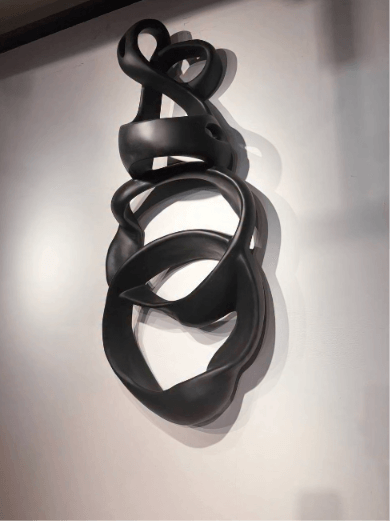 Black ribbon wall sculpture