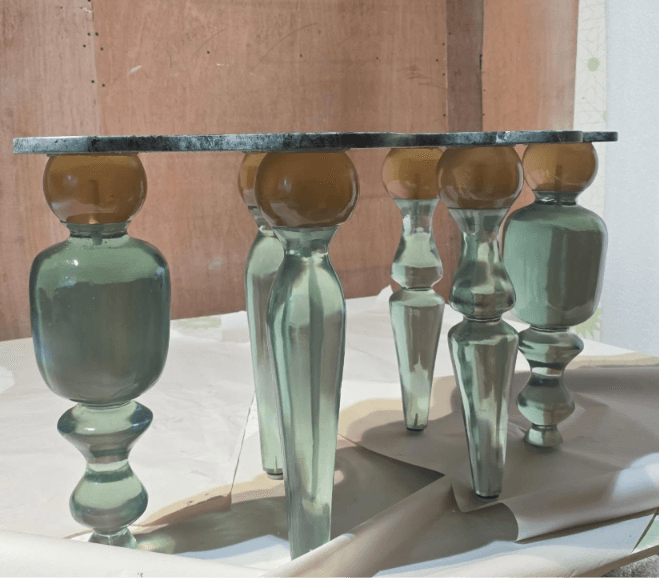 Resin table with sculptural legs