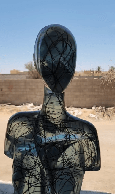 Wire-drawn standing figure